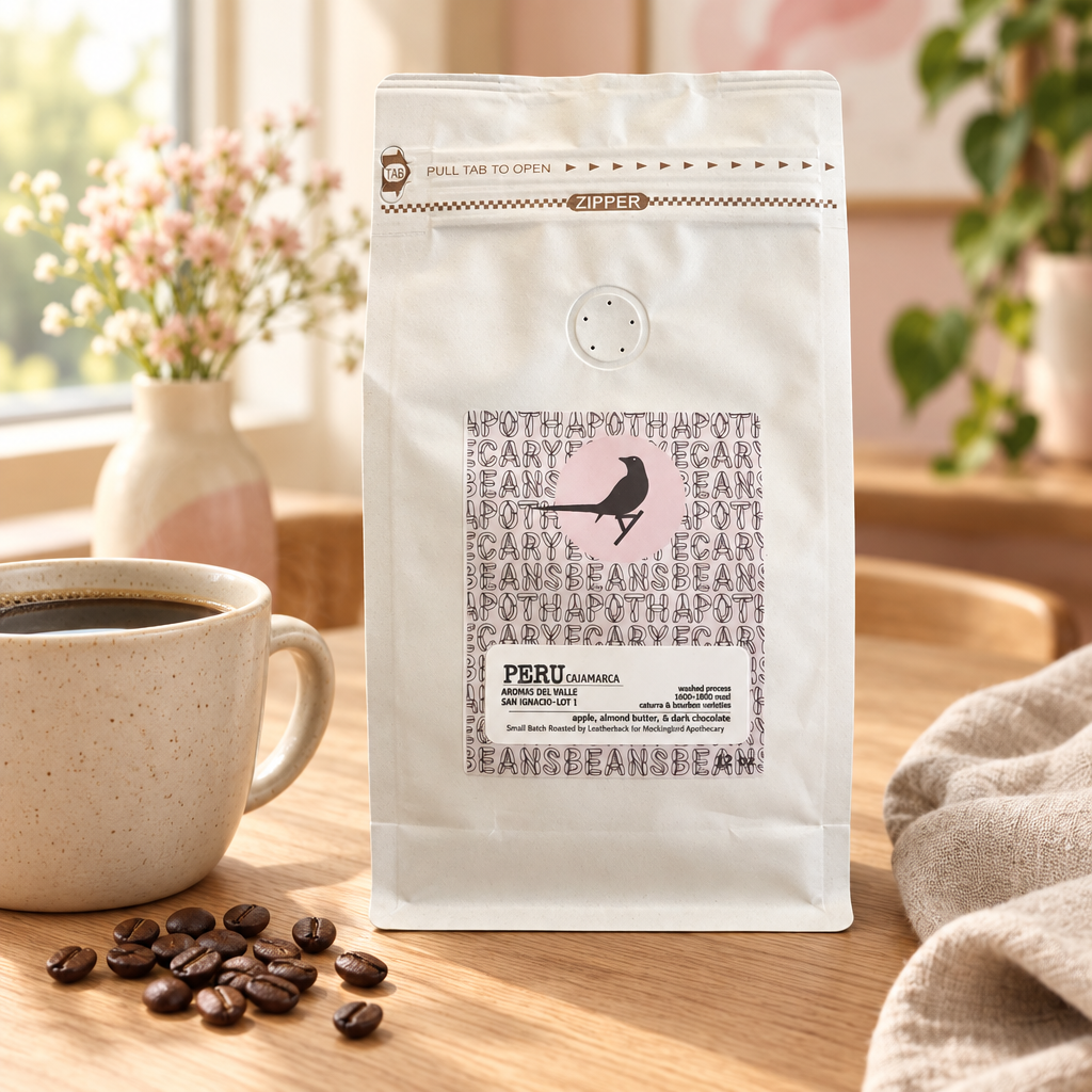 Peru Cajamarca coffee pouch beside a mug of coffee on a breakfast table