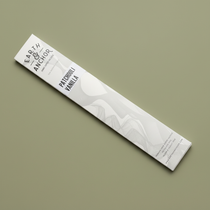 Patchouli Vanilla incense sleeve by Earth & Anchor on muted olive sage green background