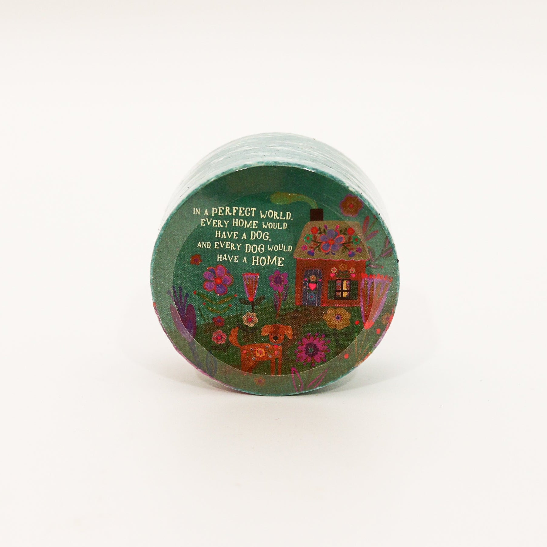 Small round container with floral design and text on a white background