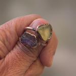 The actual amethyst and citrine ring photo with a softened background