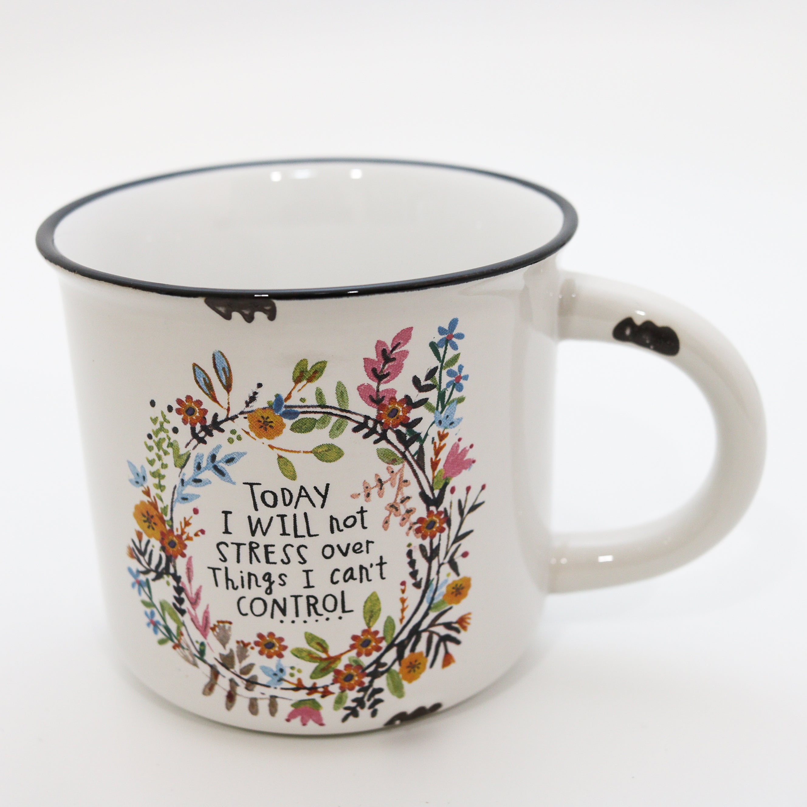 Mug with floral design and motivational quote on a white background