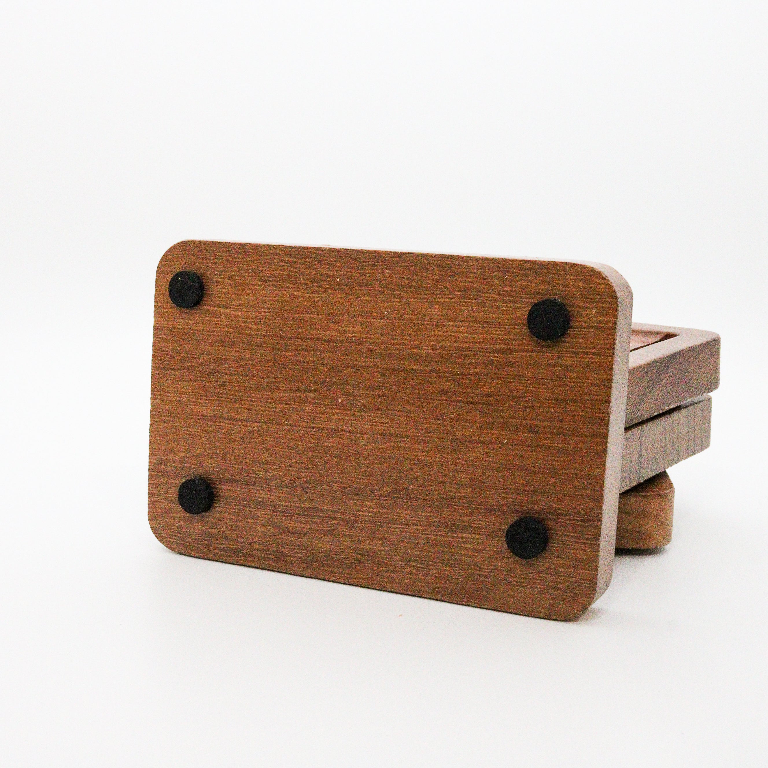 rubber buttons on bottom of Teak Wood soap dish set with black studs on a white background