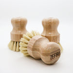 Three wooden dish brushes with bristle heads on a white background, branded 'Zefiro'.